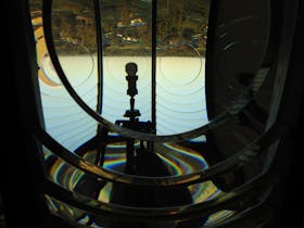 Looking through the bullseye of the lens to see the prisms and globe