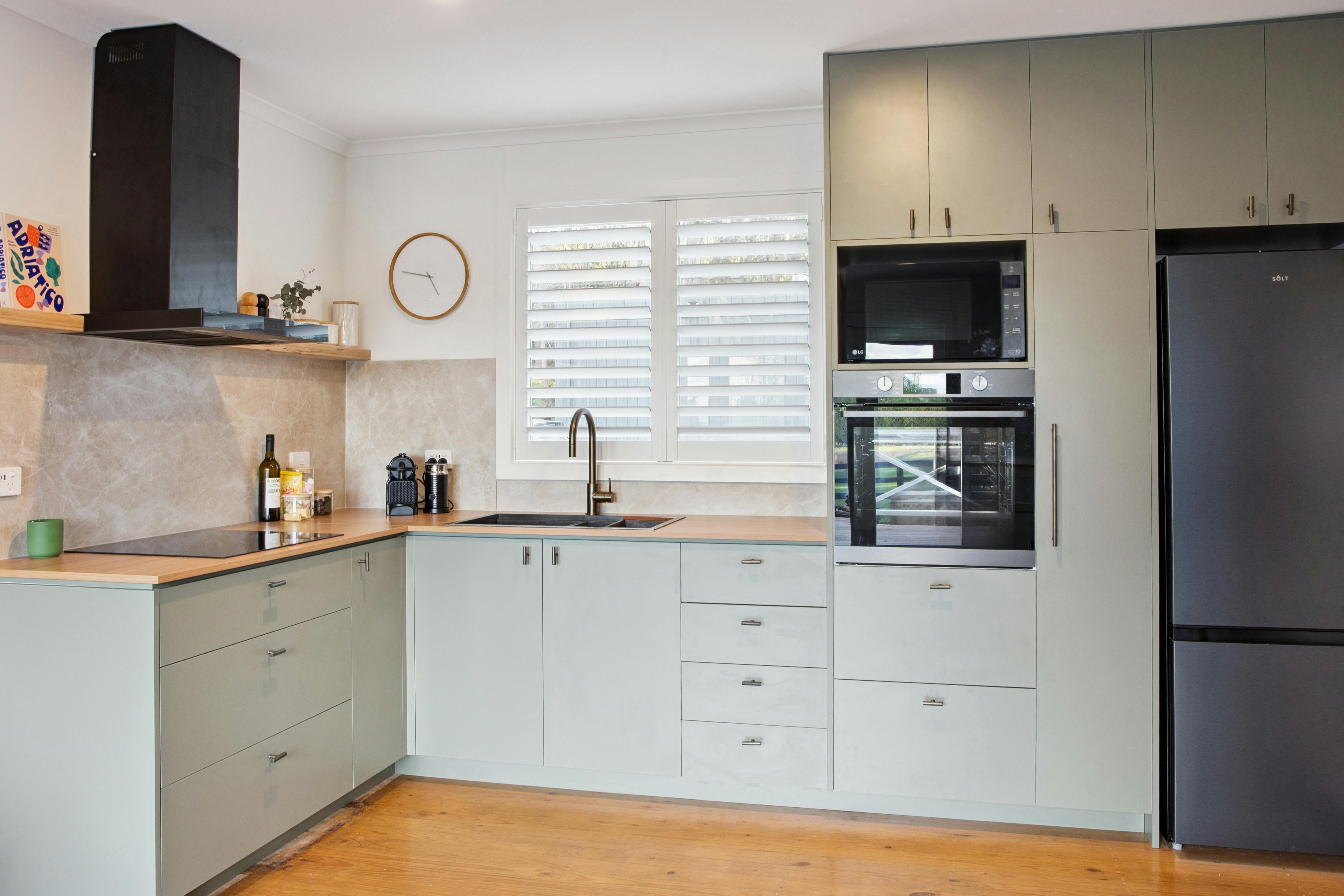 Modern kitchen espresso coffee machine, built-in oven, microwave, and full-size fridge