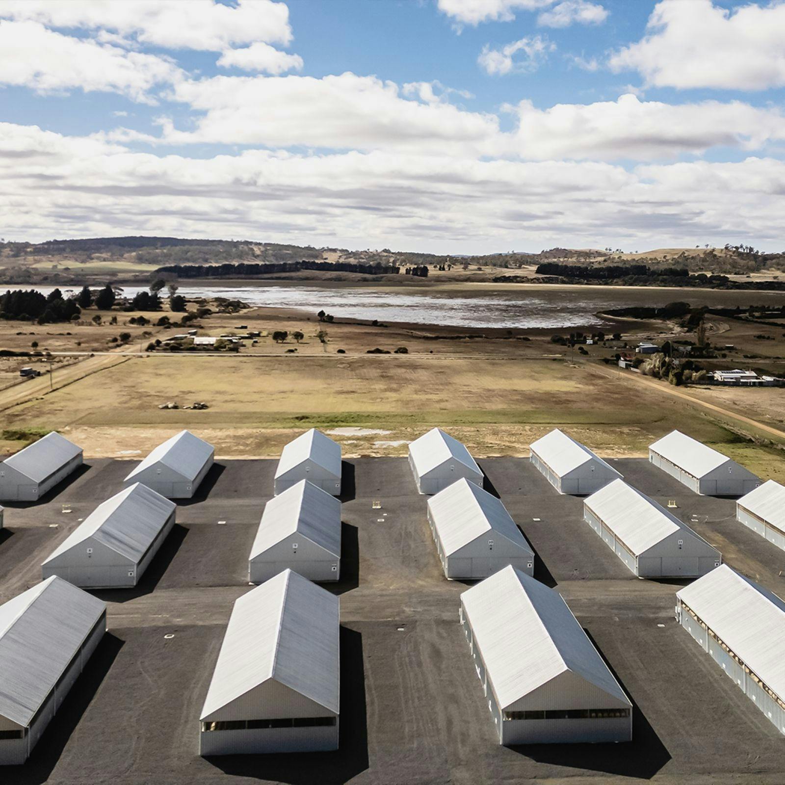 A bird's eye view of several sheds on a lot