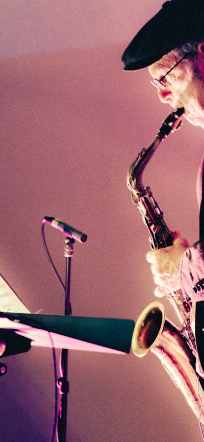 Pictured is Phillip Johnston performing with his saxophone