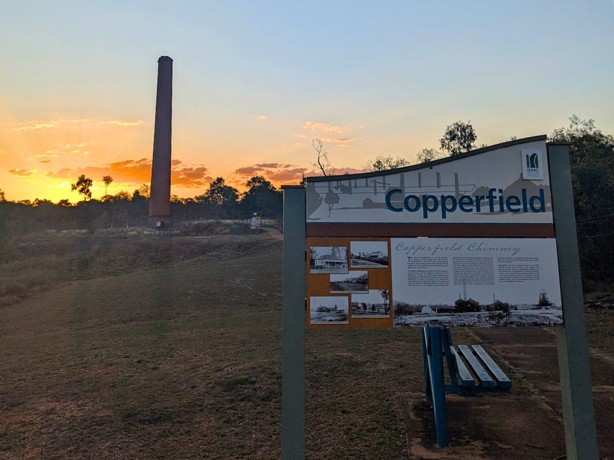 Copperfield Chimney and informative sign at sunset