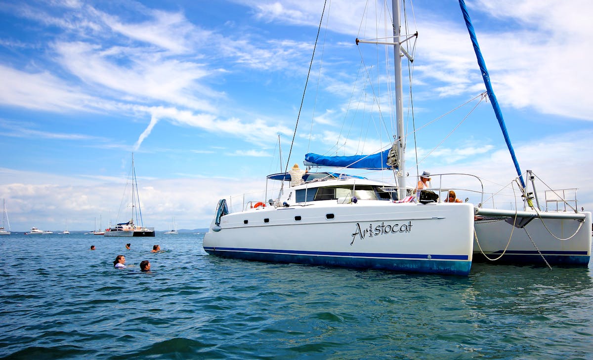 Our majestic sailing catamaran 'Aristocat' anchored in Horseshoe Bay, Peel Island