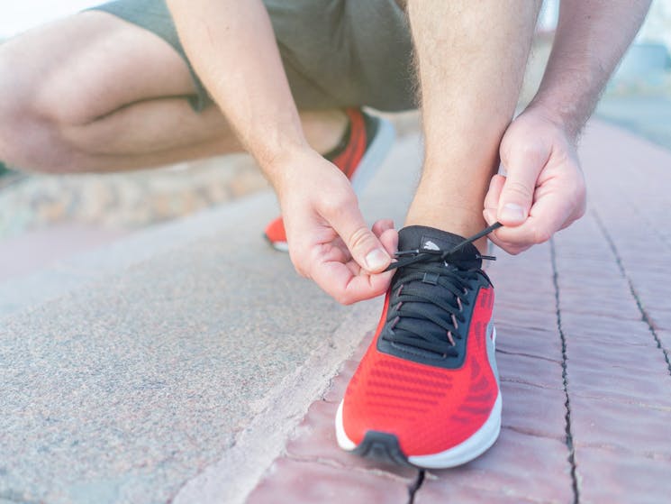 runner doing up their laces