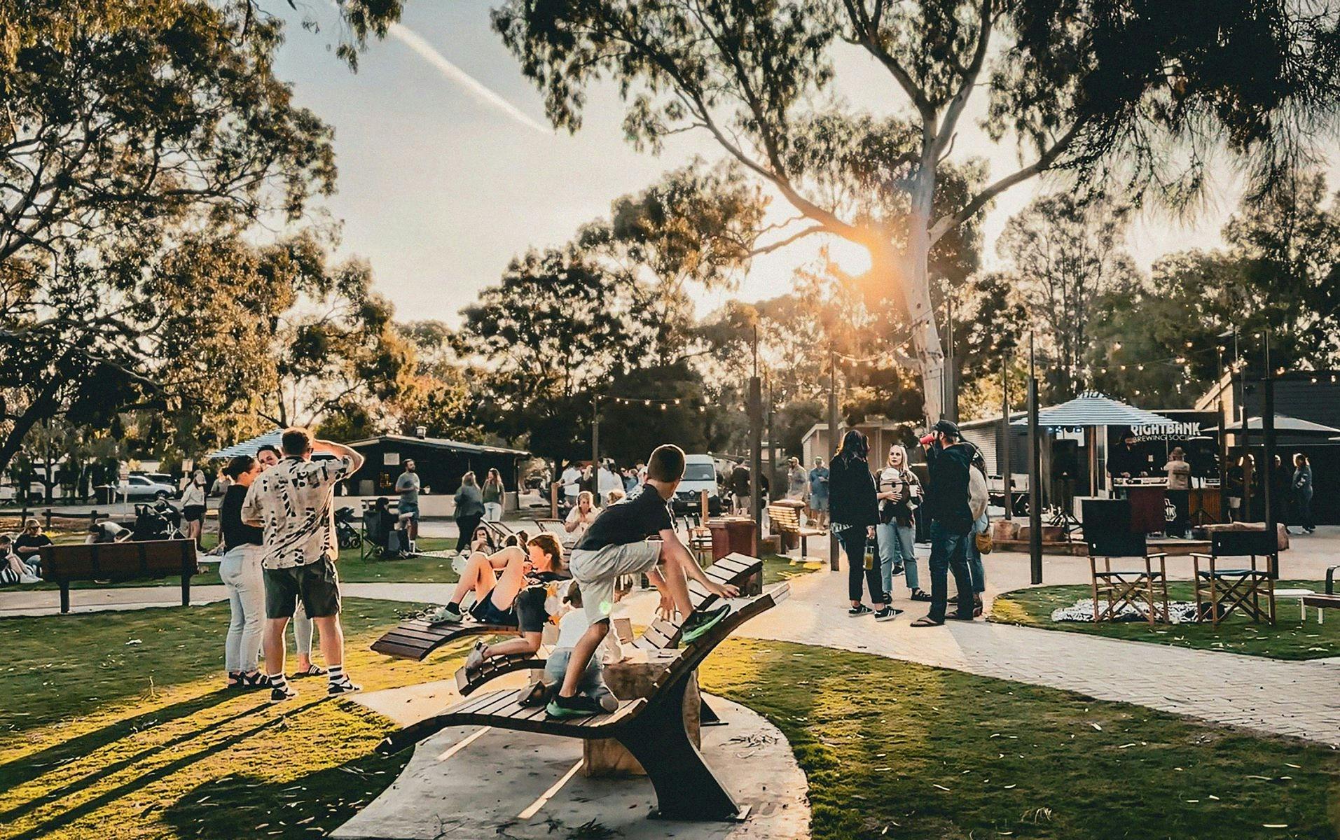 People relaxing at the Riverfront Meeting place