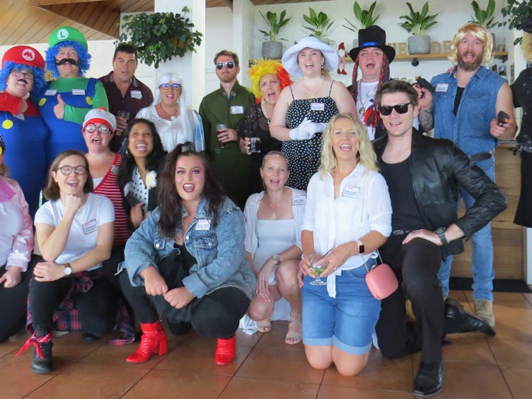 Group shot of suspects dressed as icons of popular culture