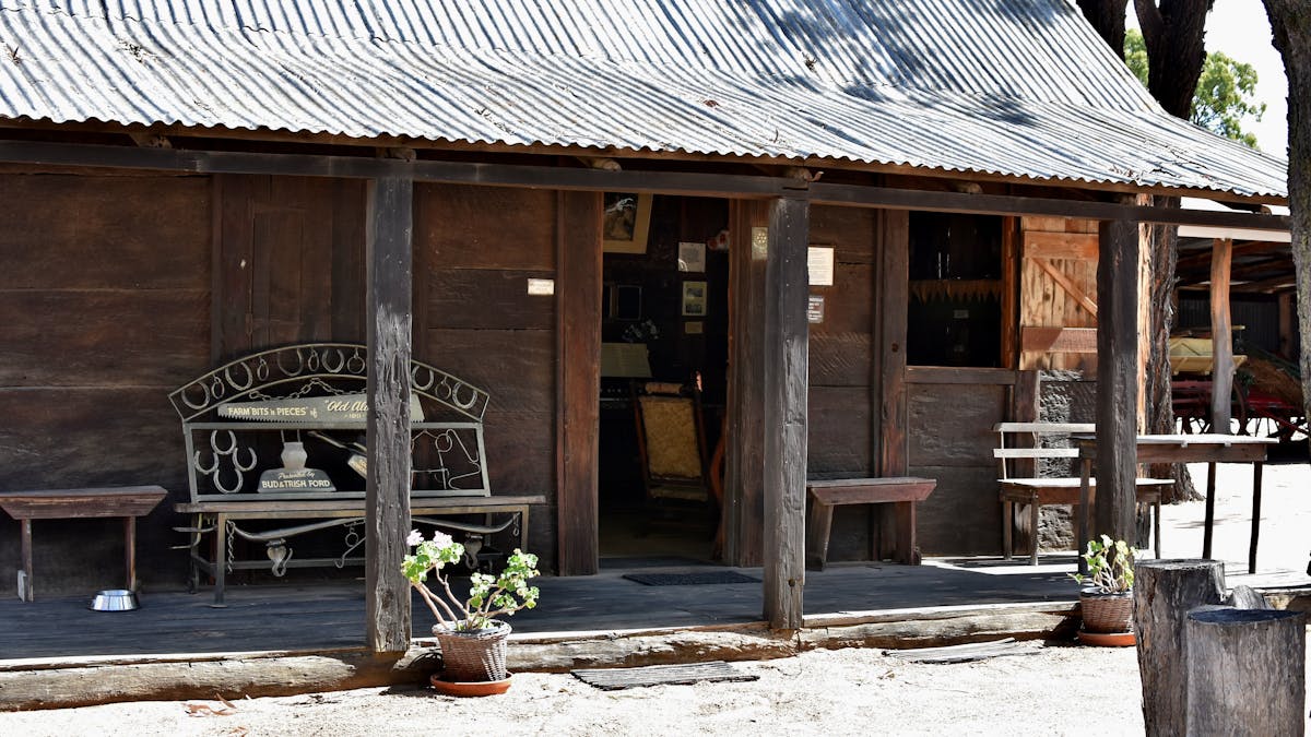 Original slab hut relocated to village grounds.