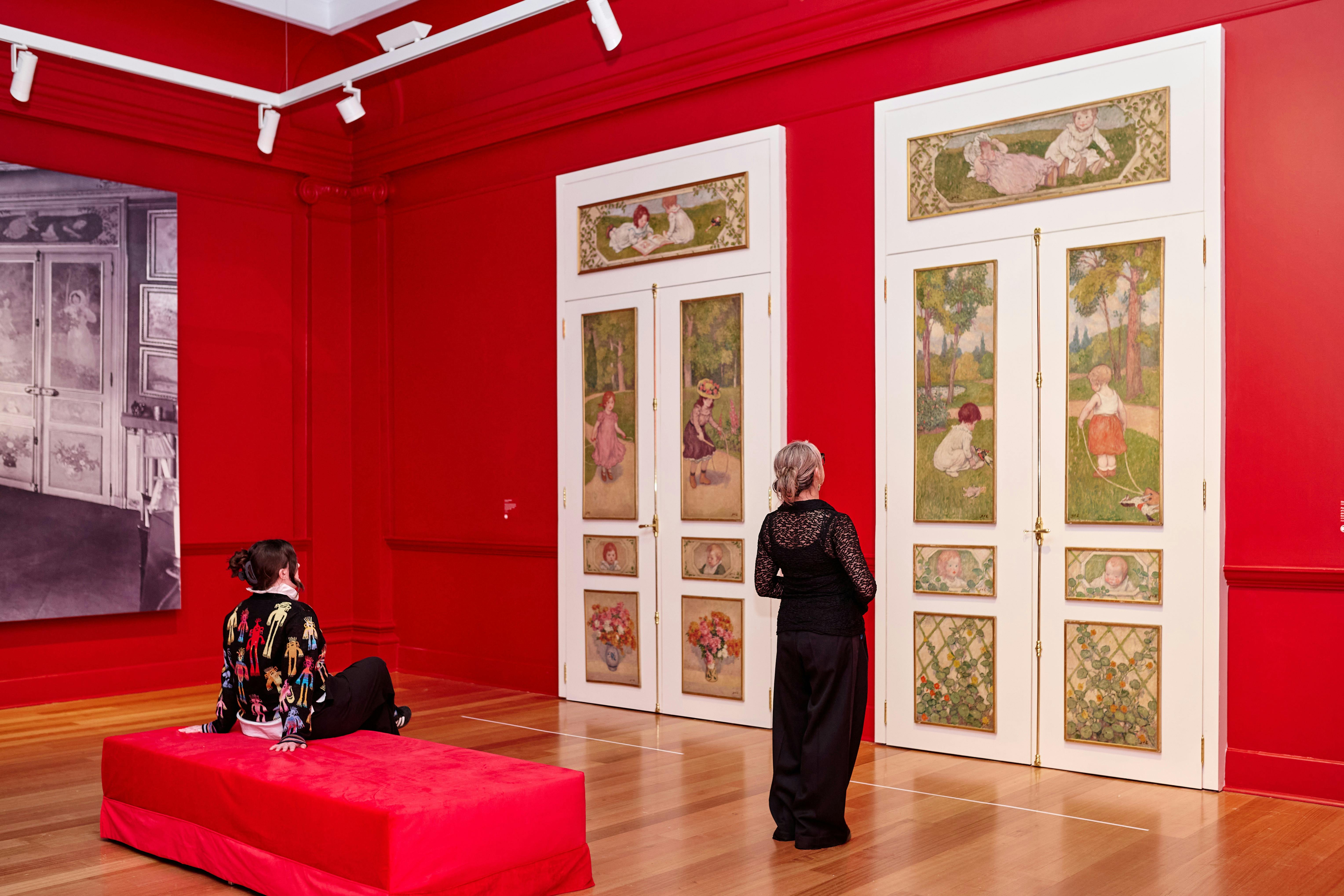 two visitors looking at an Impressionist artwork in gallery