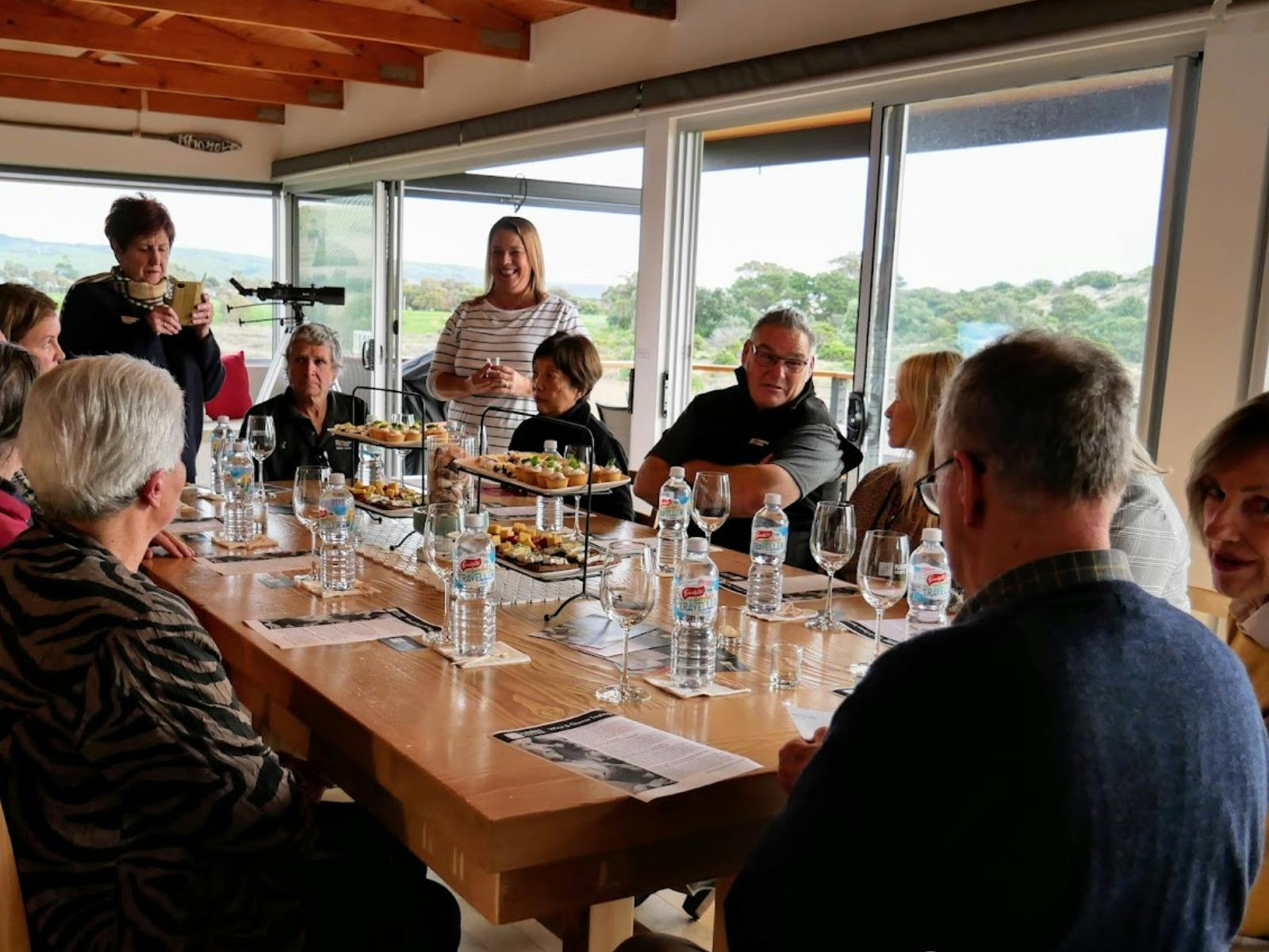 Group enjoying a wine and cheese tasting