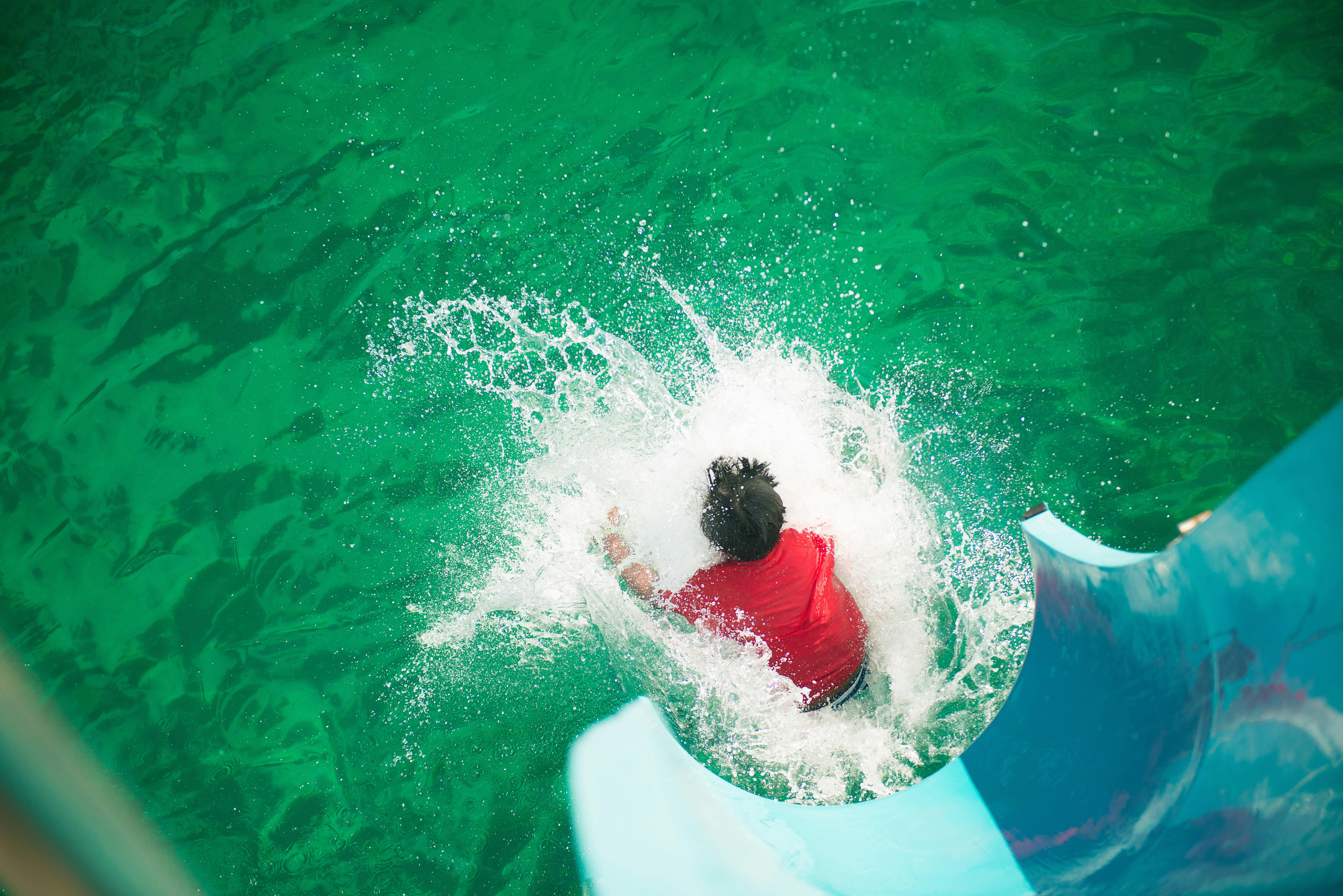 Boy sliding down slide