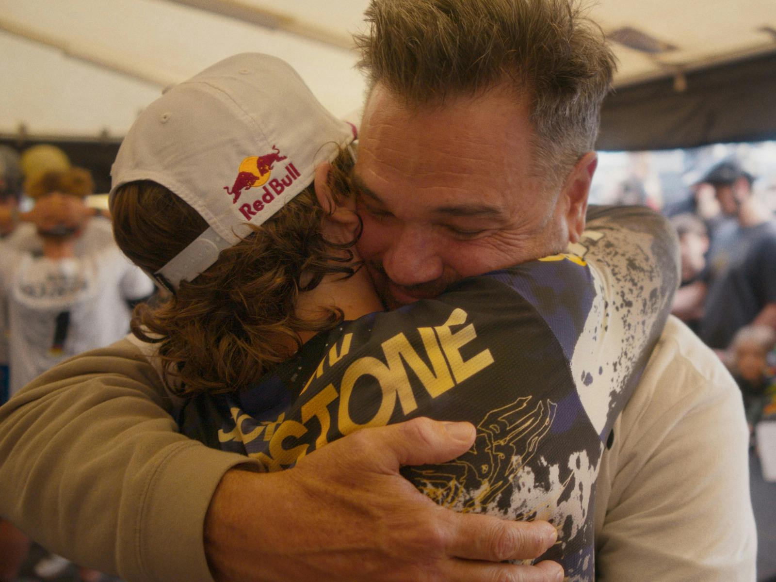 Son and father hugging