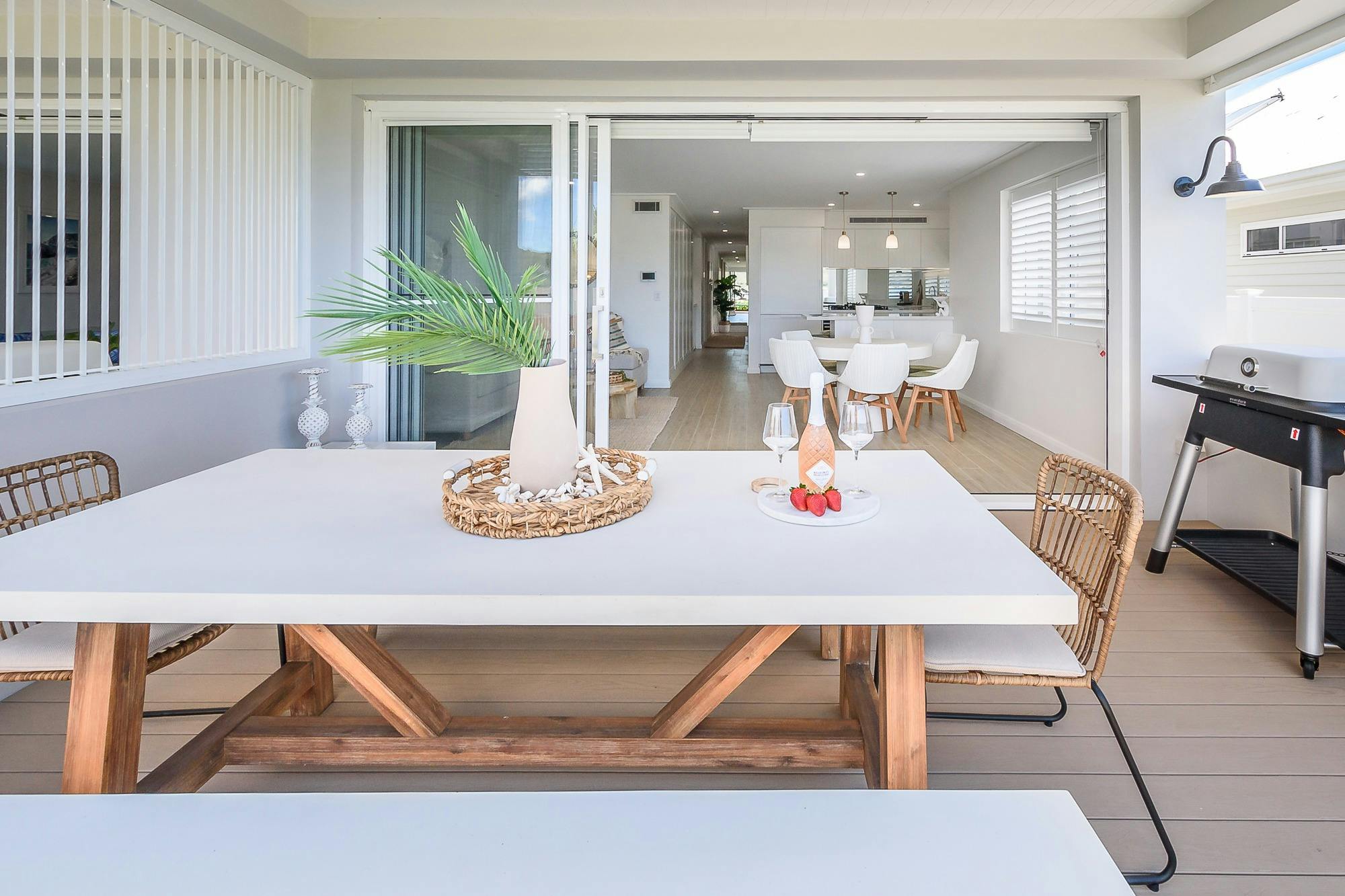 relax on deck overlooking gardens and Booker Bay