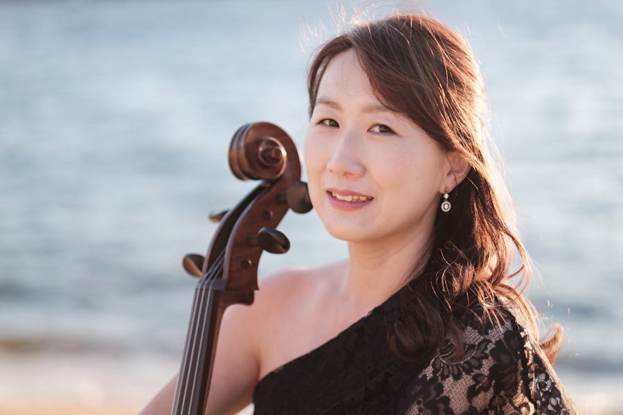 Minah Chloe sitting with her cello