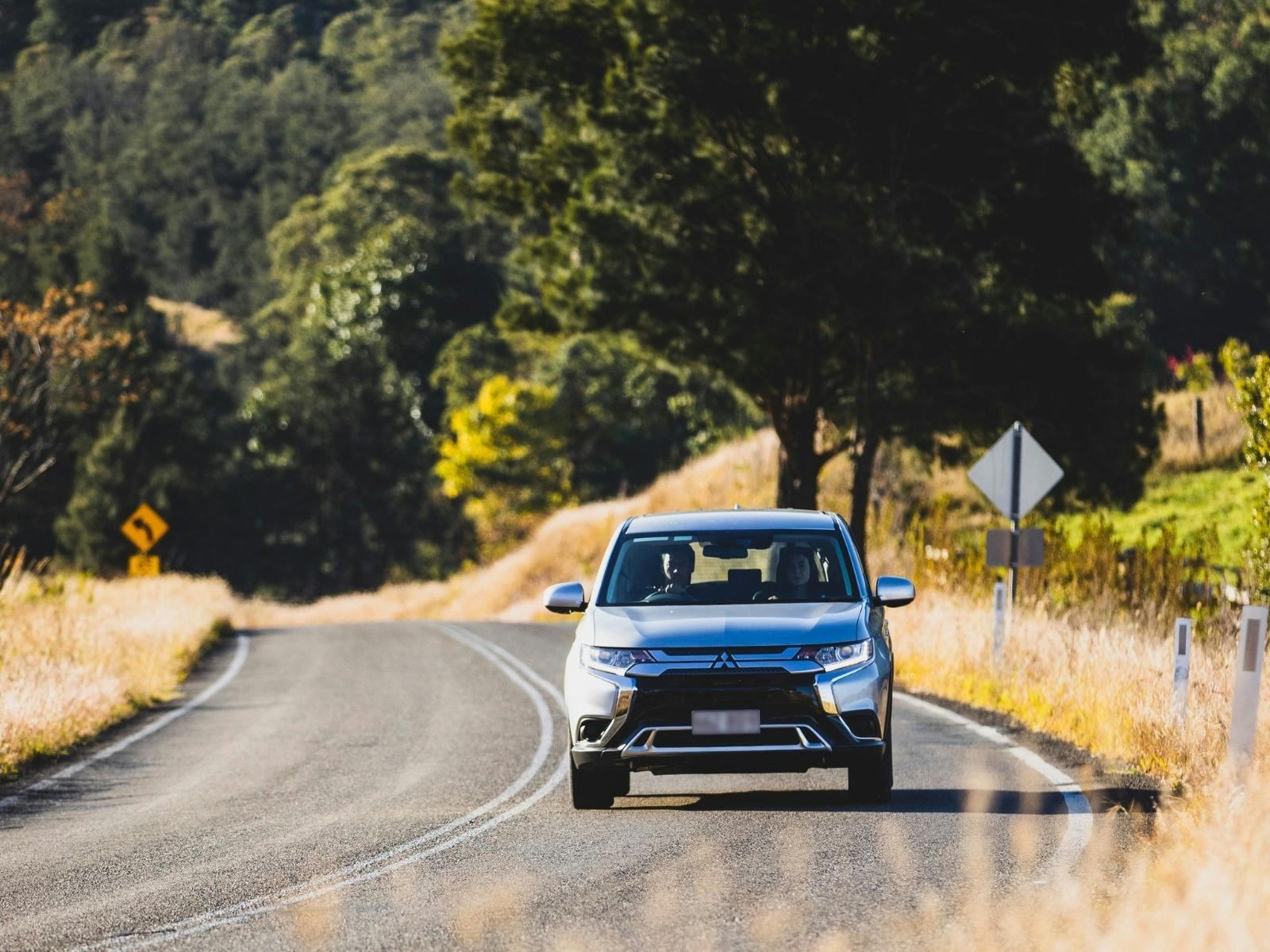 A family enjoying a scenic holiday drive together in a car
