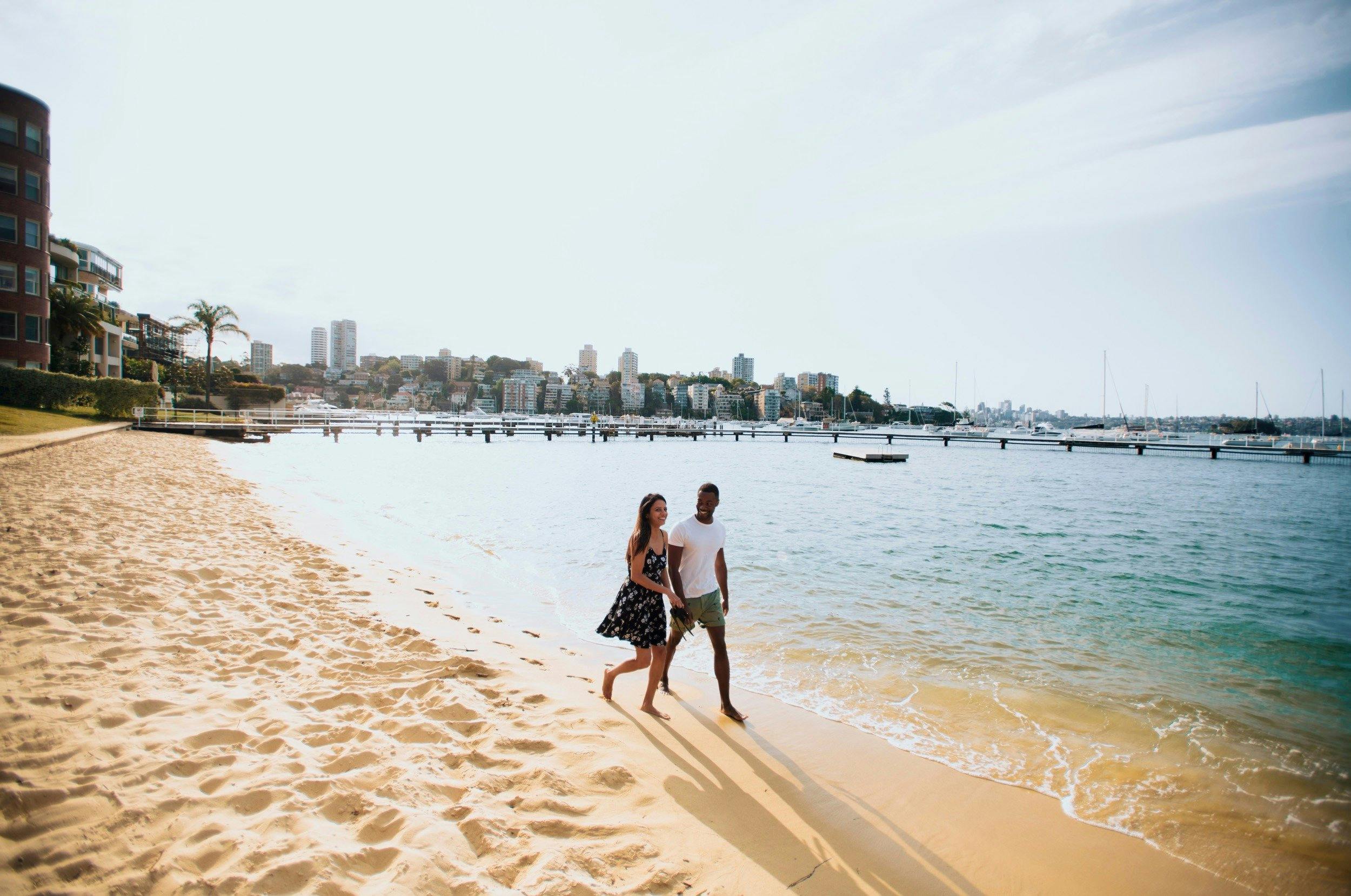 Couple enjoying a walk by Murray Rose Pool, Double Bay