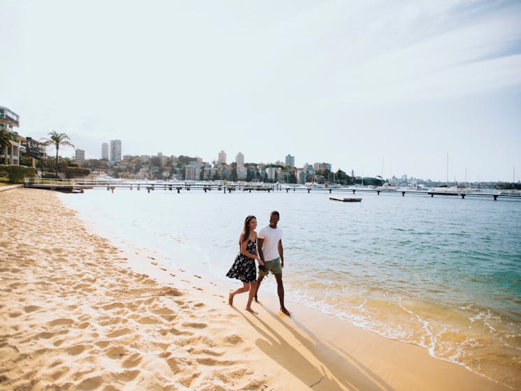 Couple enjoying a walk by Murray Rose Pool, Double Bay