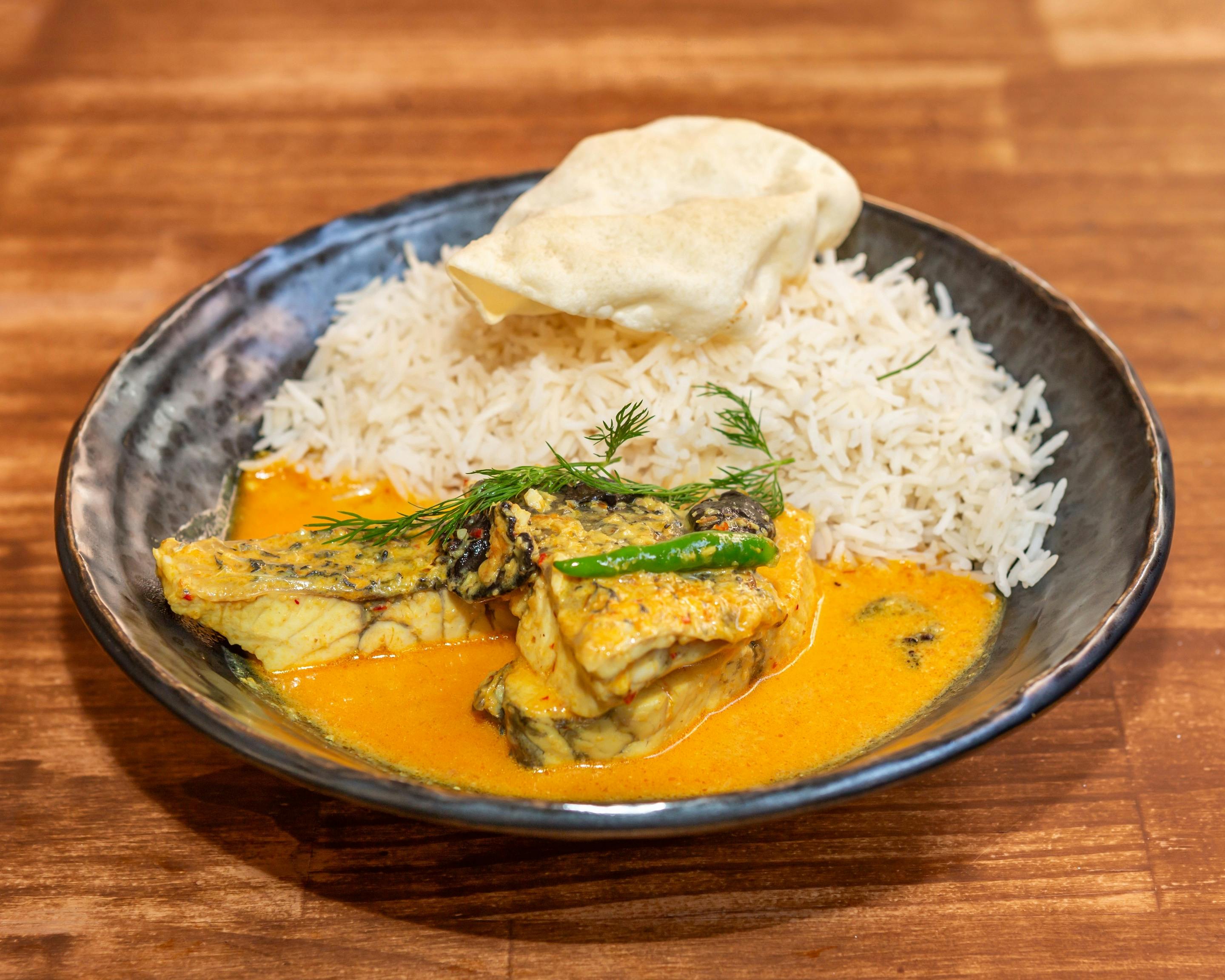 Barramundi cooked in a rich coconut & chili based curry sauce.