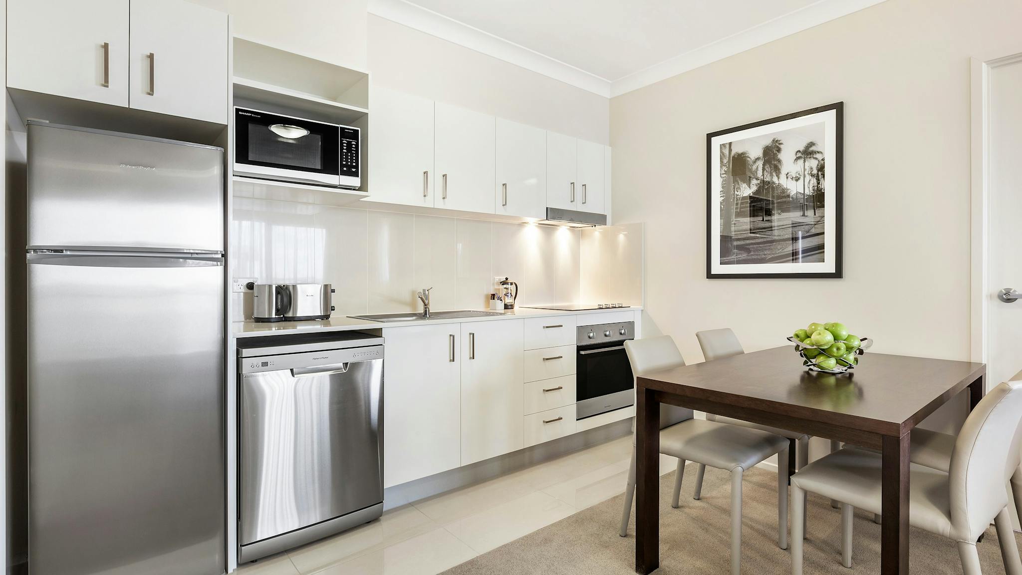 Fully equipped kitchen and dining area Fully equipped kitchen and dining area