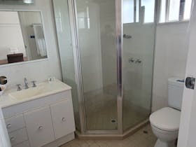large vanity with corner shower