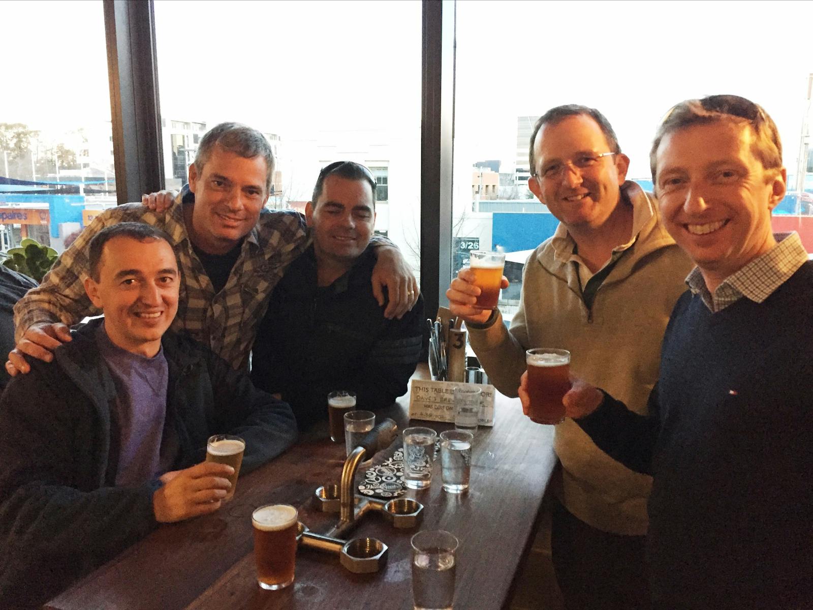 Five men with beer