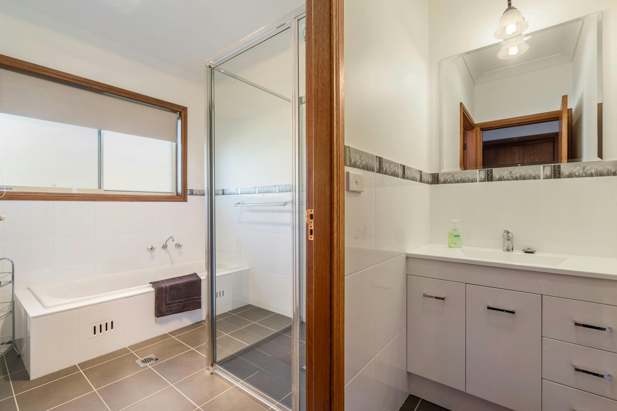 Bathroom with bath, shower and separate vanity