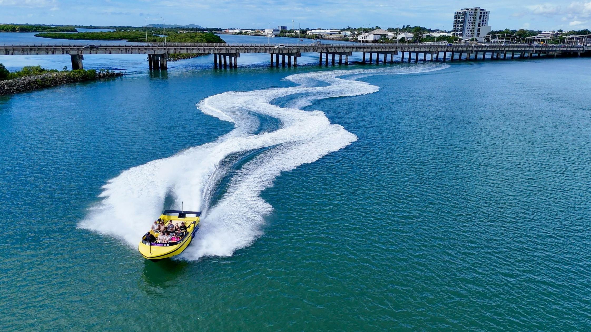 aerial image of jet boat leaving white water trail