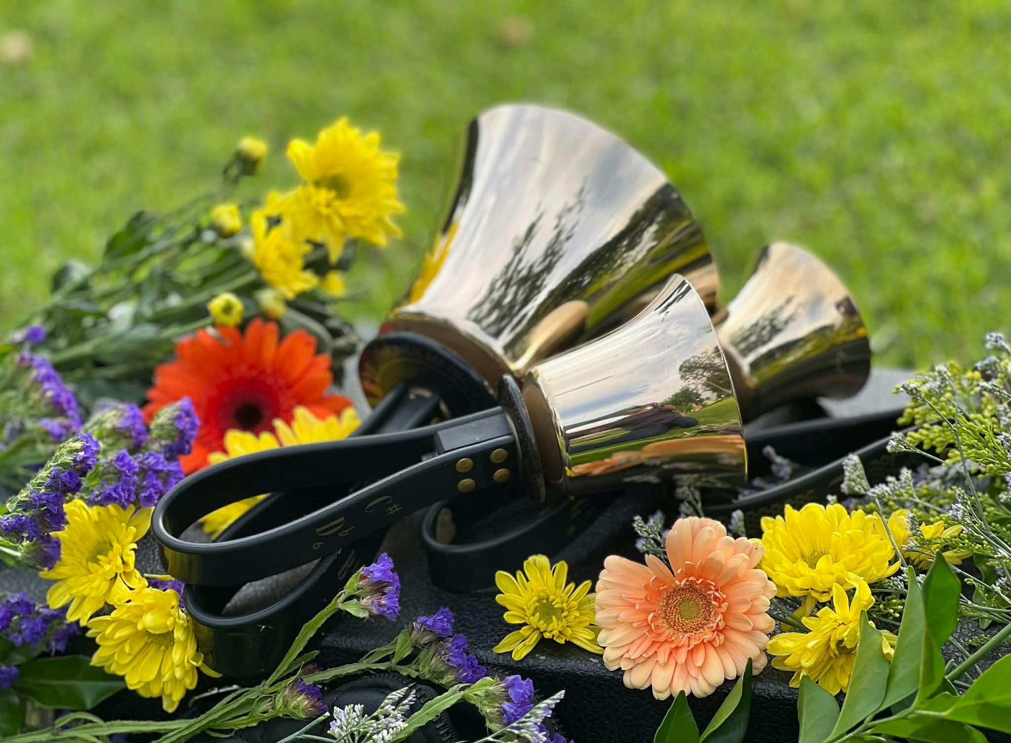 Toowoombells Handbell Choir with bells and flowers