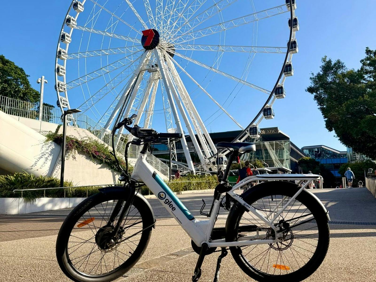 Explore South Bank’s iconic landmarks on a Glee e-Bike with the Wheel of Brisbane in the background