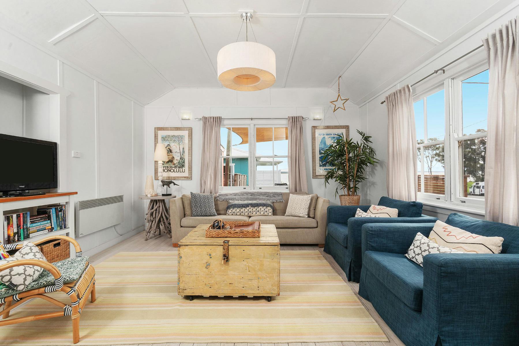 Avalon's comfy living room is bright and sunny