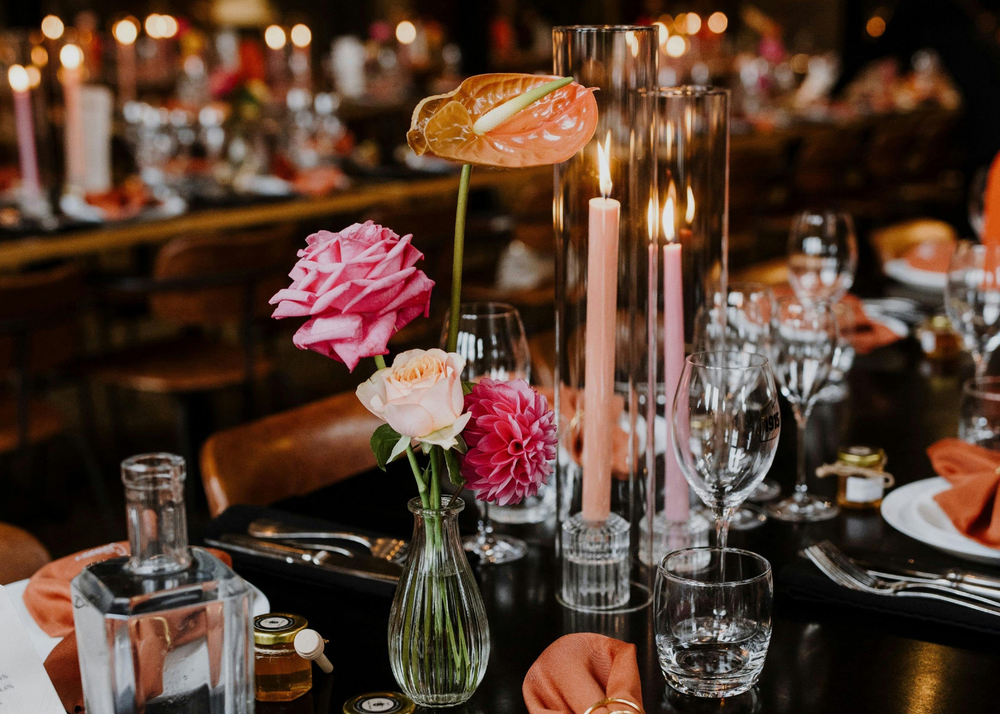 Table setting with flowers and candles at 1915 Restaurant & Bar