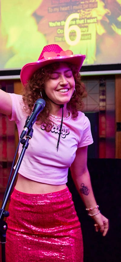 Two girls singing karaoke in Old Parliament House