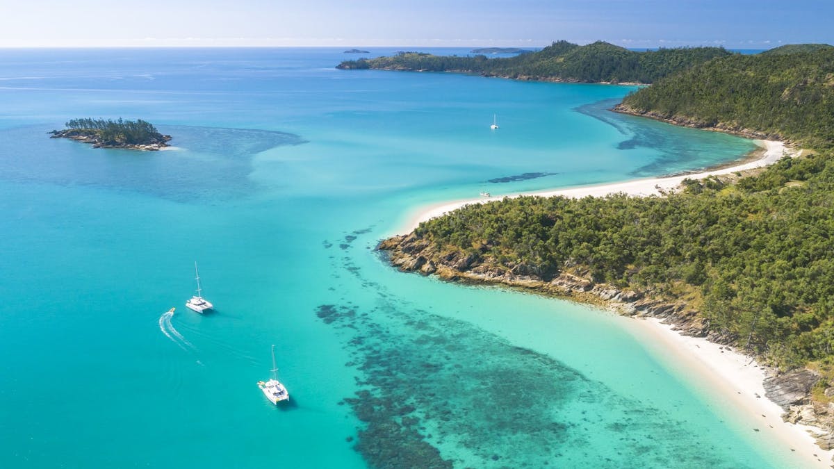 Two Sailing Catamarans moored in the Whitsunday Islands