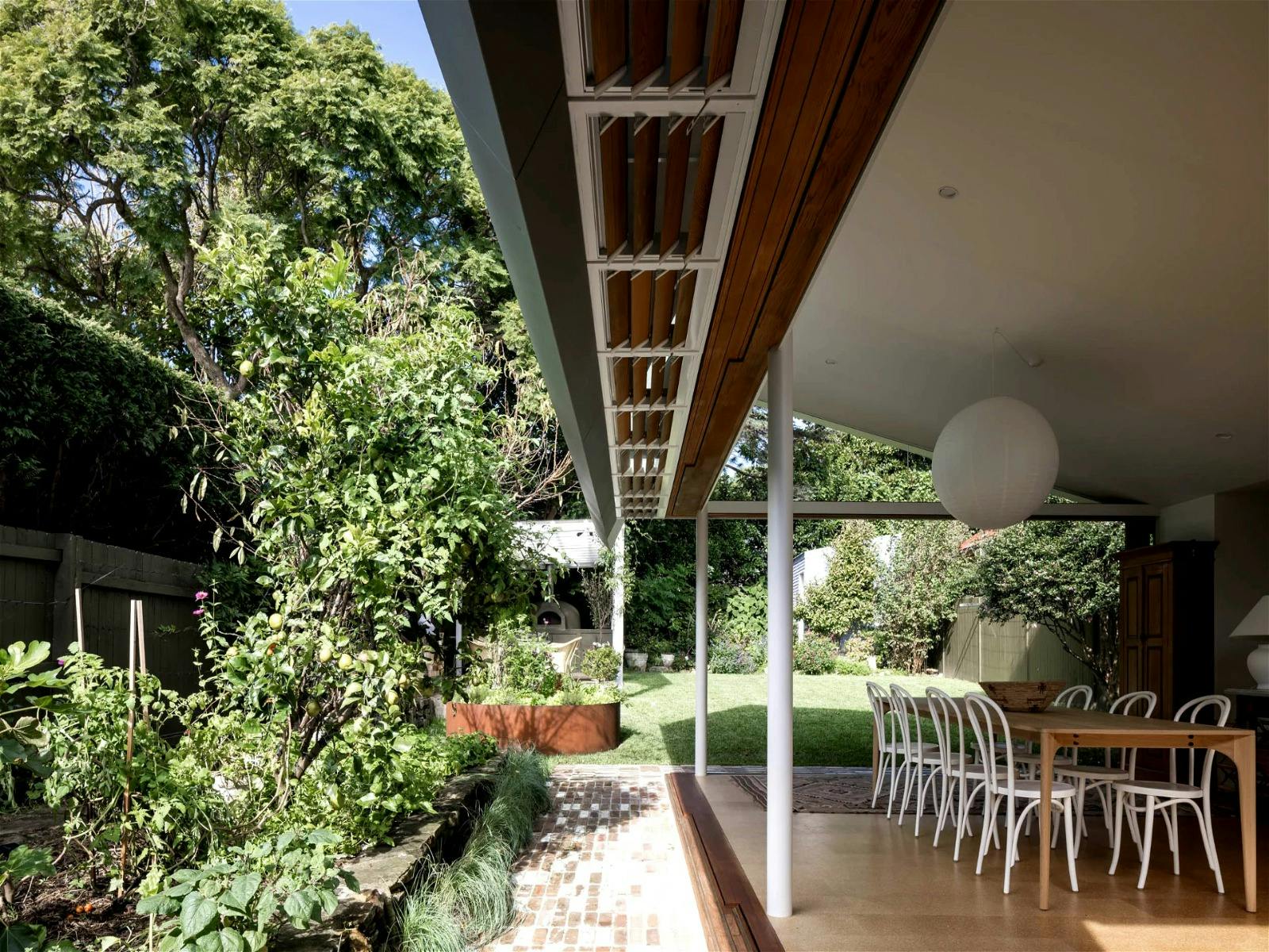 The back of the house is all about the kitchen, living, dining, and of course the garden