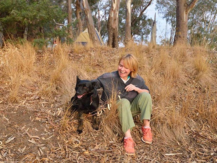 Camper with her dog in Murray Valley Regional Park. Photo: Gavin Hansford/NSW Government