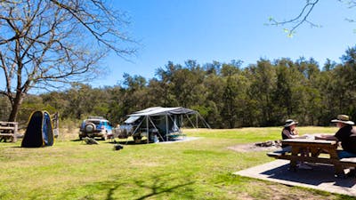 A couple having lunch on a park bench, Bendethera Valley campground, Deua National Park. Photo: