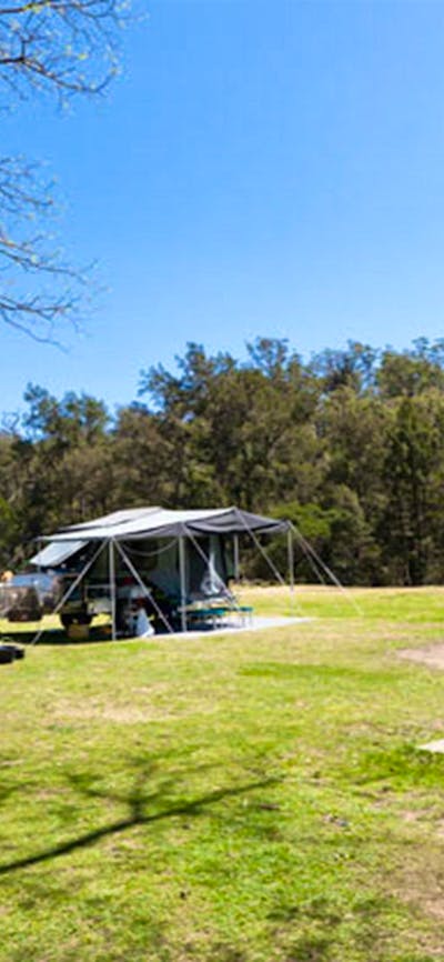 A couple having lunch on a park bench, Bendethera Valley campground, Deua National Park. Photo: