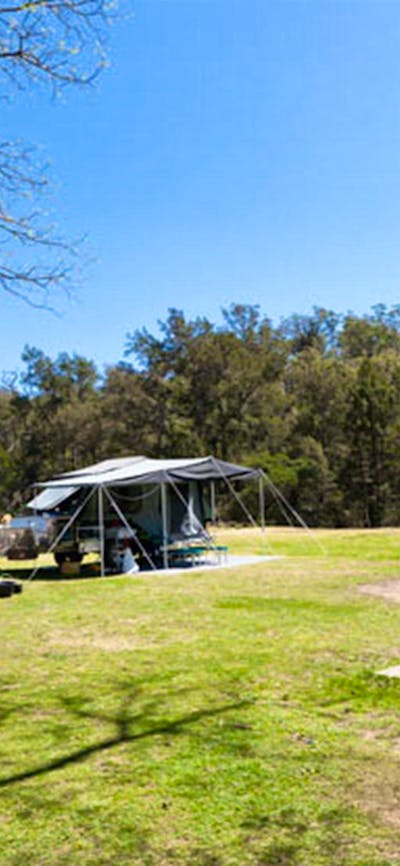 A couple having lunch on a park bench, Bendethera Valley campground, Deua National Park. Photo: