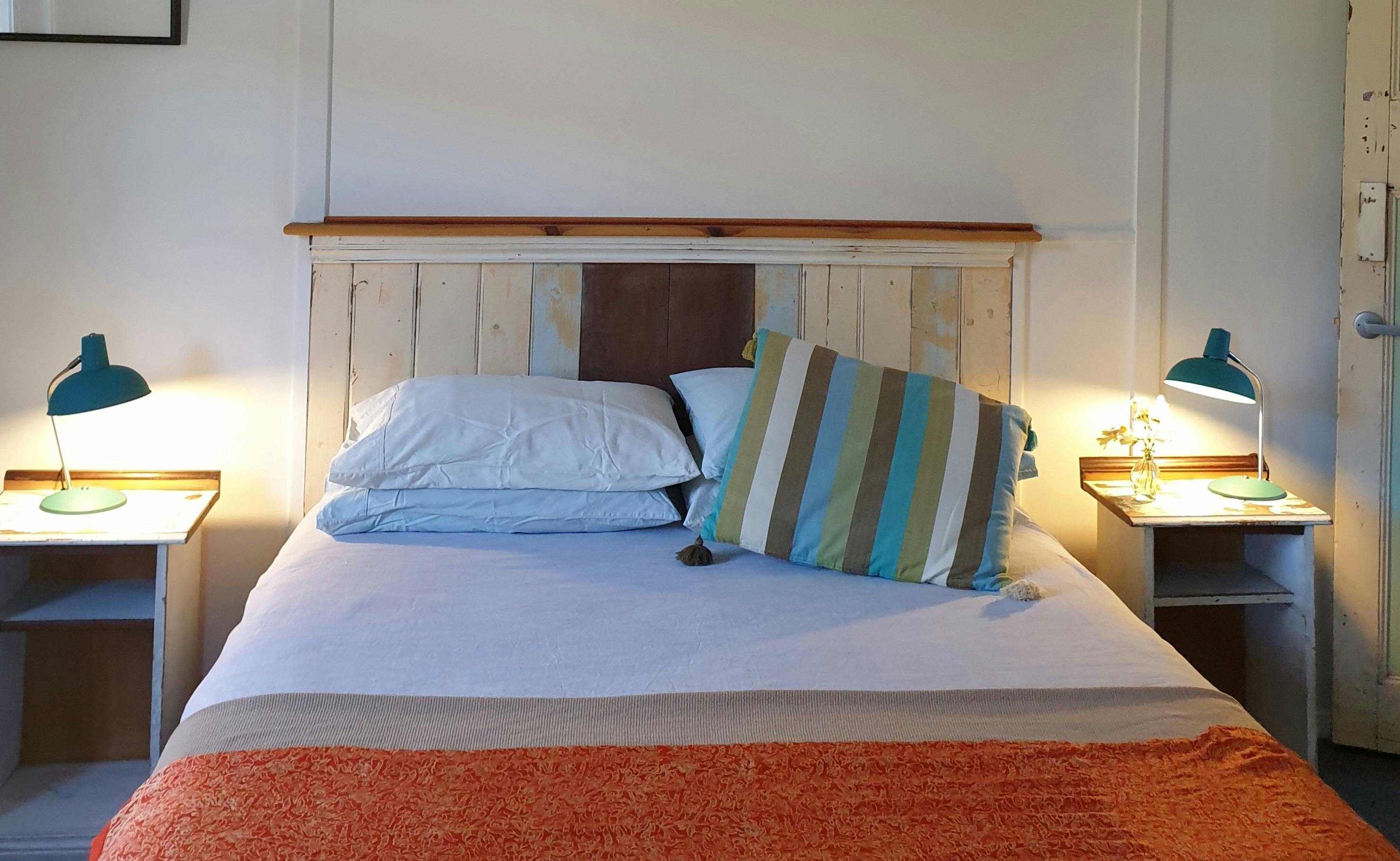 Bedroom showing bed an bedside tables