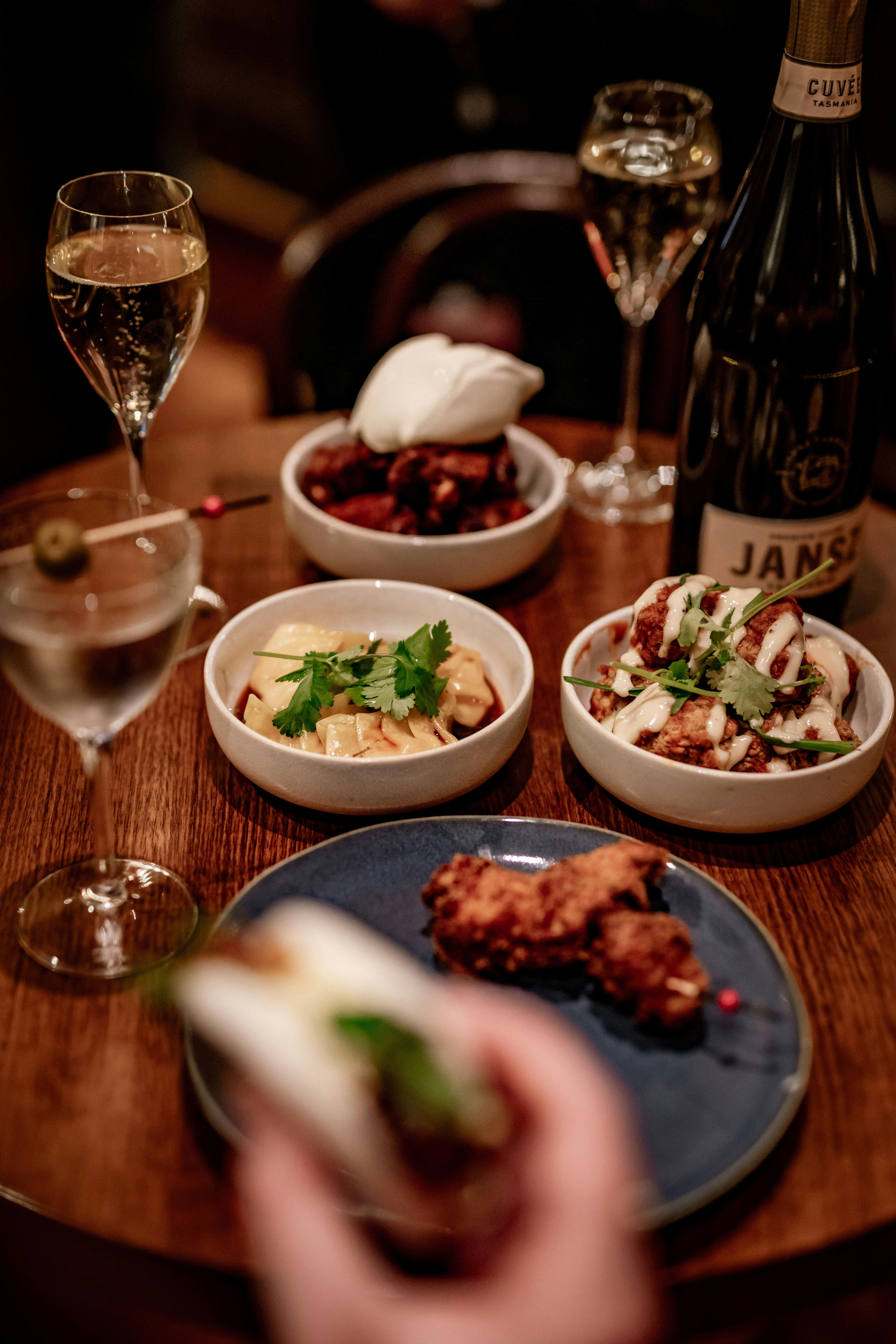 Bar Nosh menu items covering the table in the Orient Bar