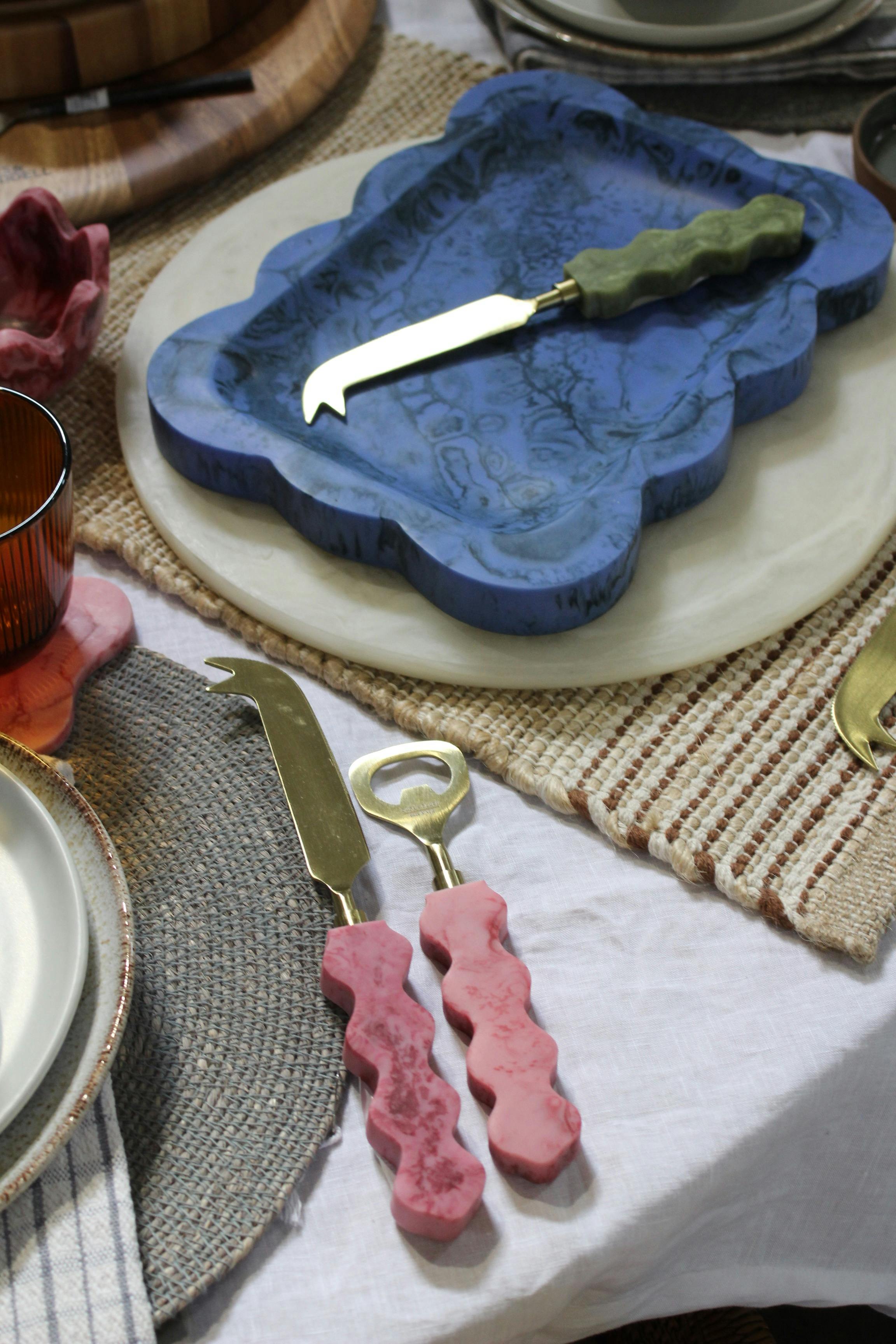 Cheese knife, cutting board and bottle opener