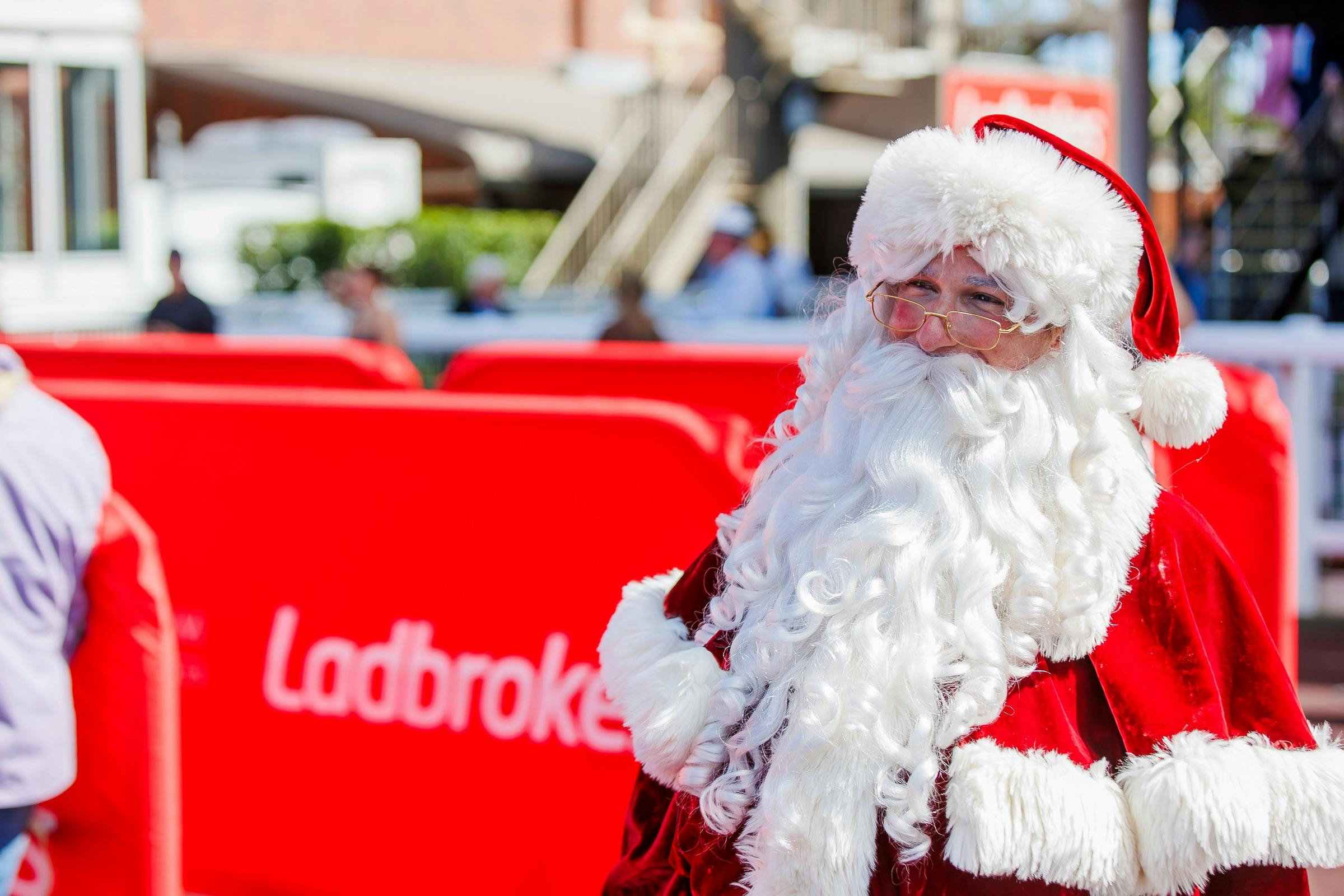 Santa standing in the Eagle Farm mounting yard, smiling