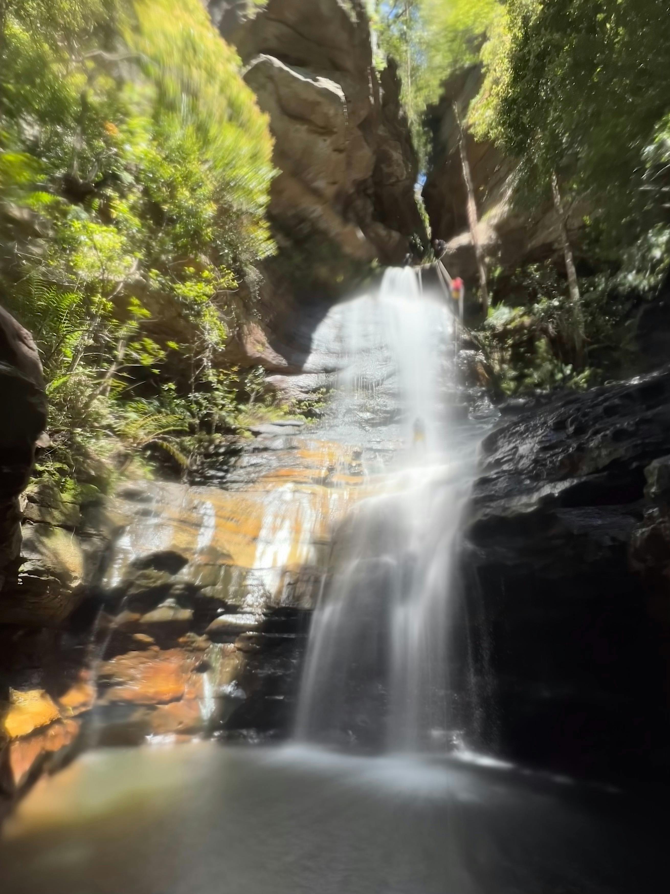A  photo of Empress Falls with Abseilers near the top