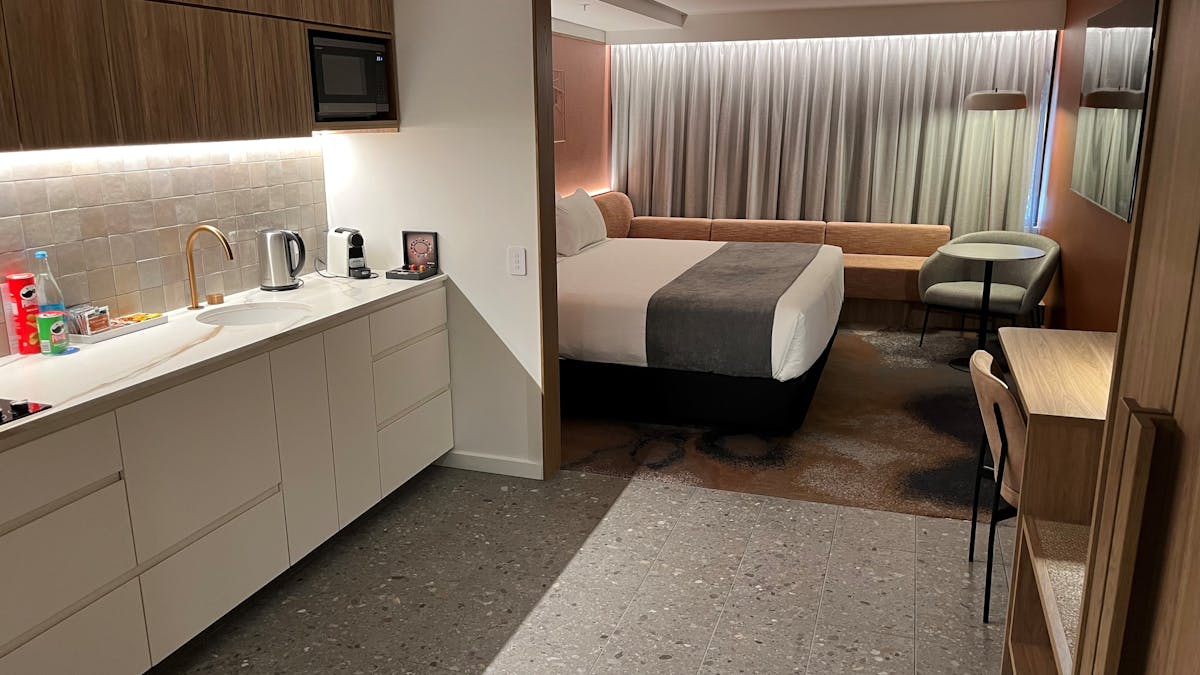 A kitchenette on the left hand side, leading into the bedroom with a Super king bed