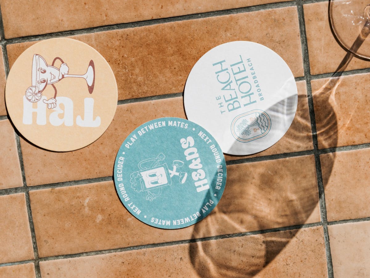 Coasters and wine glass in the sun