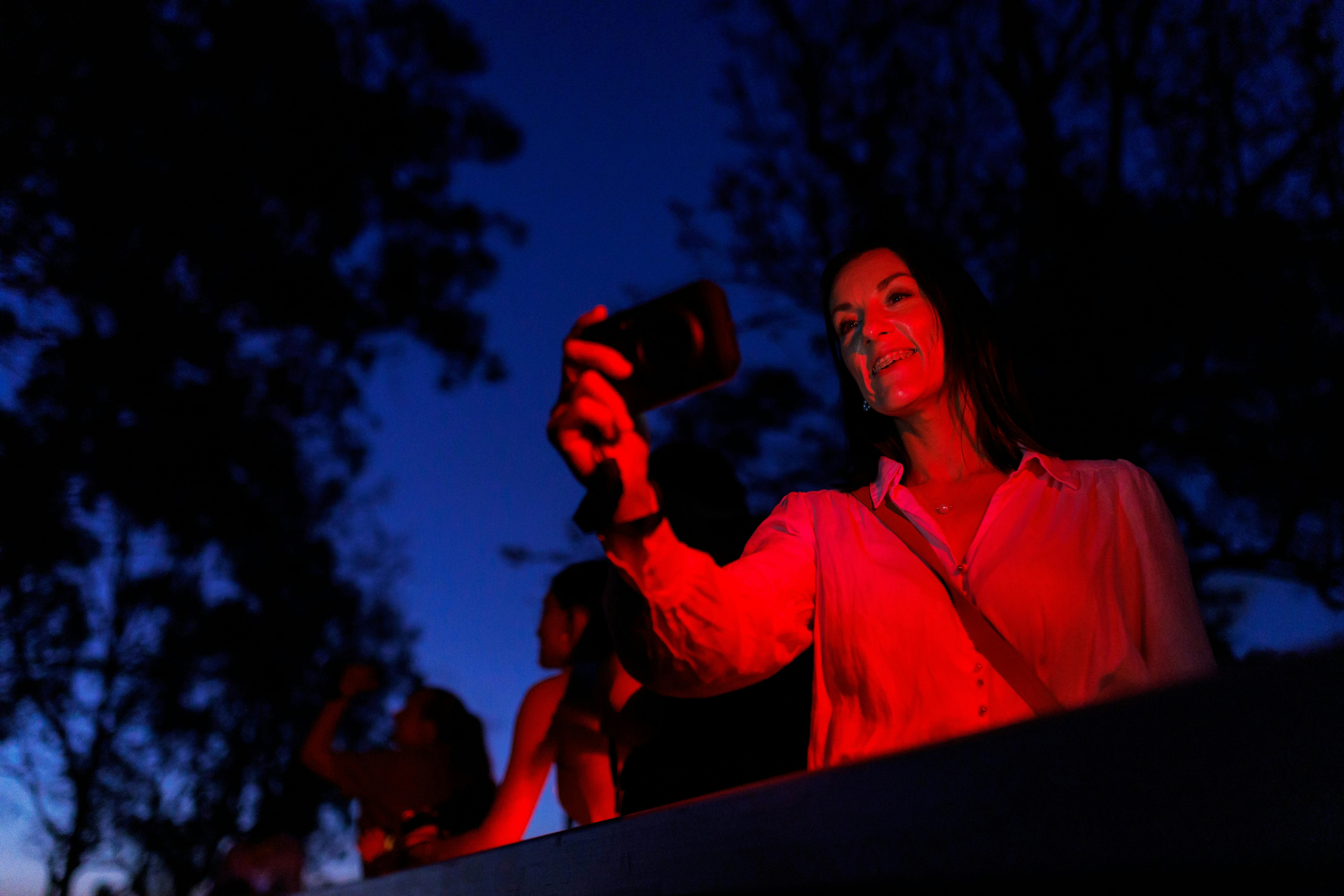 Guest using thermal-imaging night vision equipment to locate wildlife in the dark