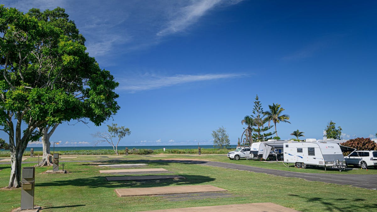 Powered sites with concrete slabs on the beach.