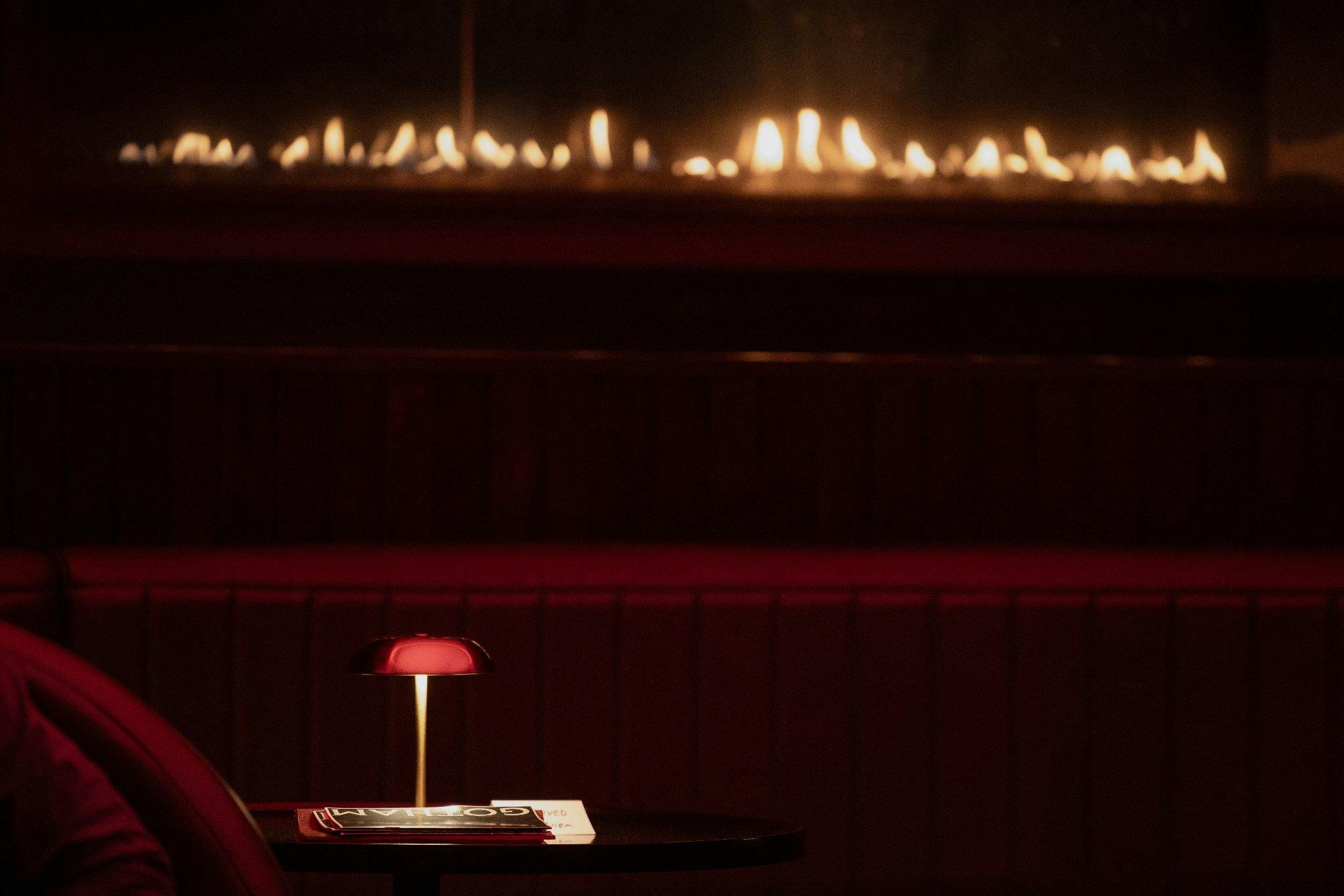 Menu and lamp by the fire
