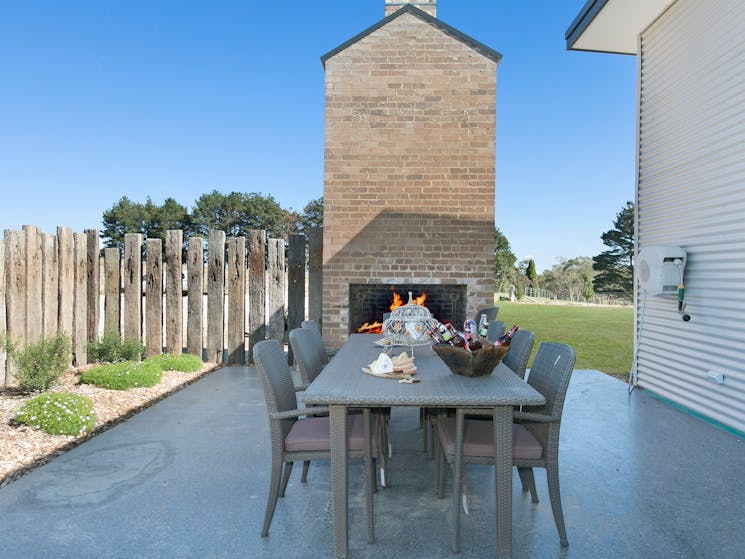 Outdoor Fireplace with casual dining
