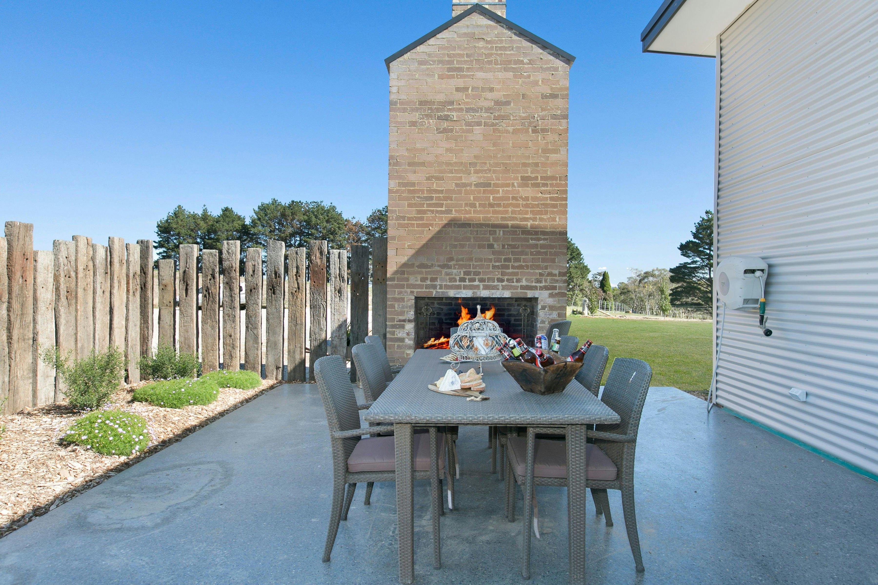 Outdoor Fireplace with casual dining