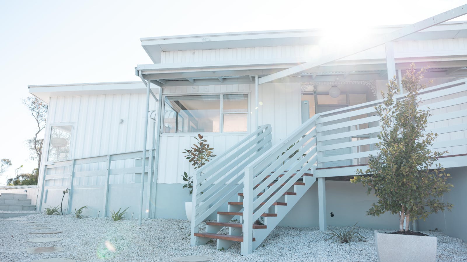 Charming entryway with coastal decor, leading into a bright and welcoming beach house