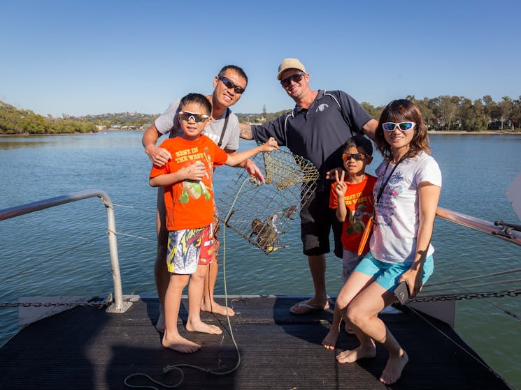 Crab Catching fun with Tweed Eco Cruises fishing tours for the family